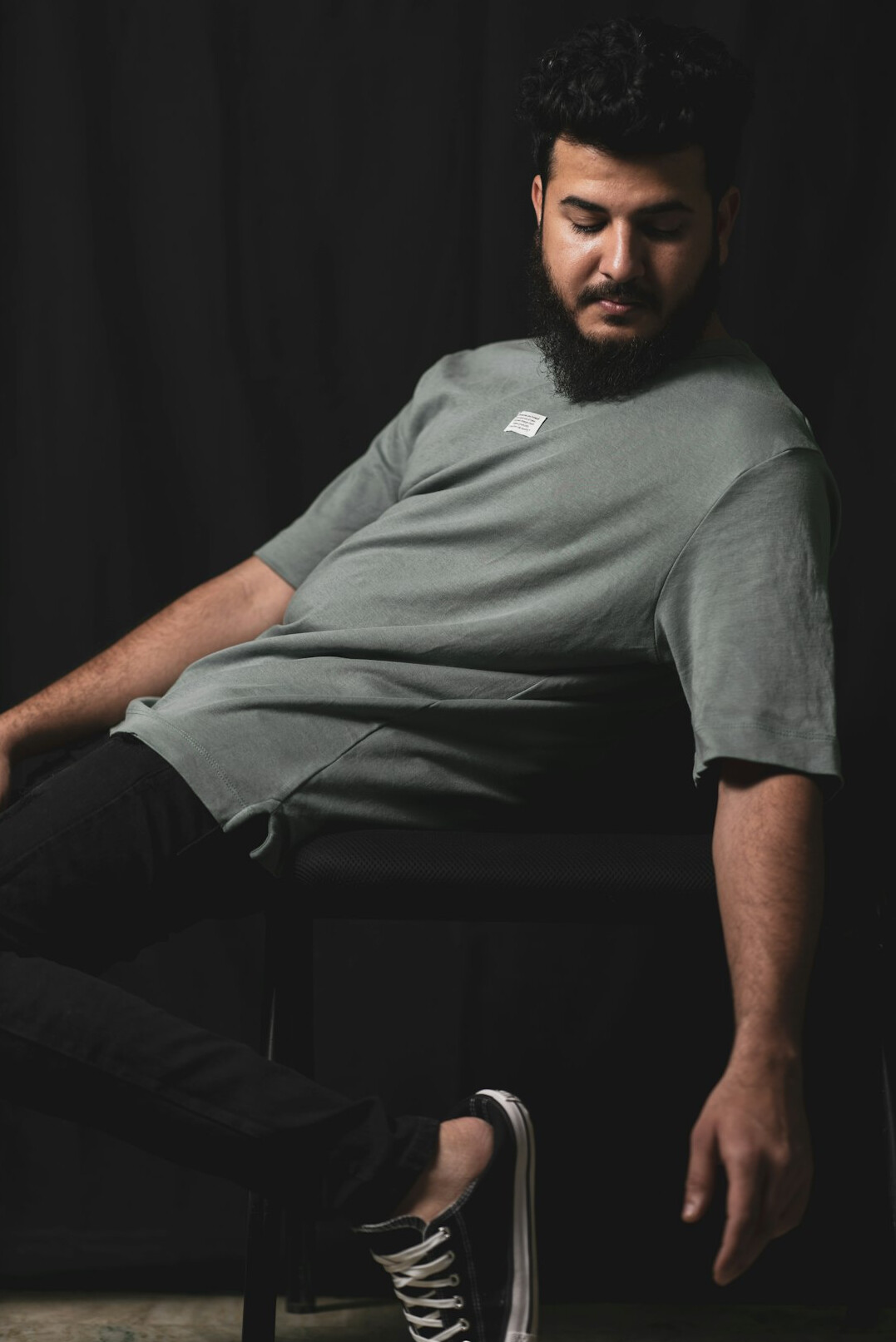 Studio portrait of a man with a beard in casual wear